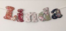 Lower case letters with wadding and eyelets